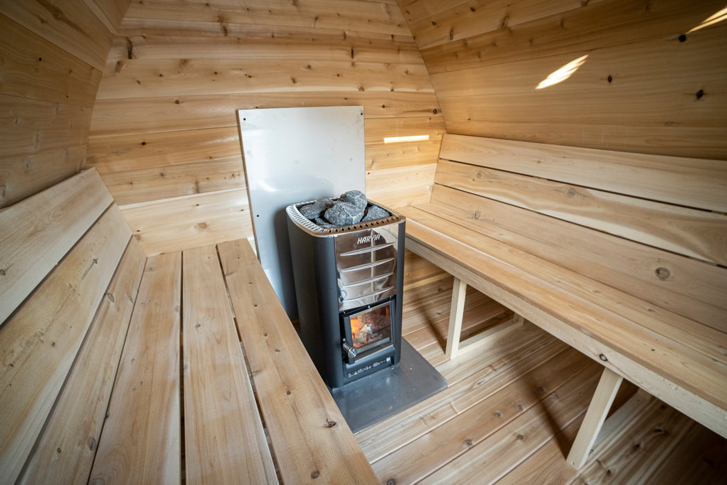 CT MiniPOD Sauna: 7x7, Handcrafted in Canada, 1.5" Eastern White Cedar, Seating for 4, Tempered Glass Door, Asphalt Shingles, Wood Burning or Electric Heater Options.