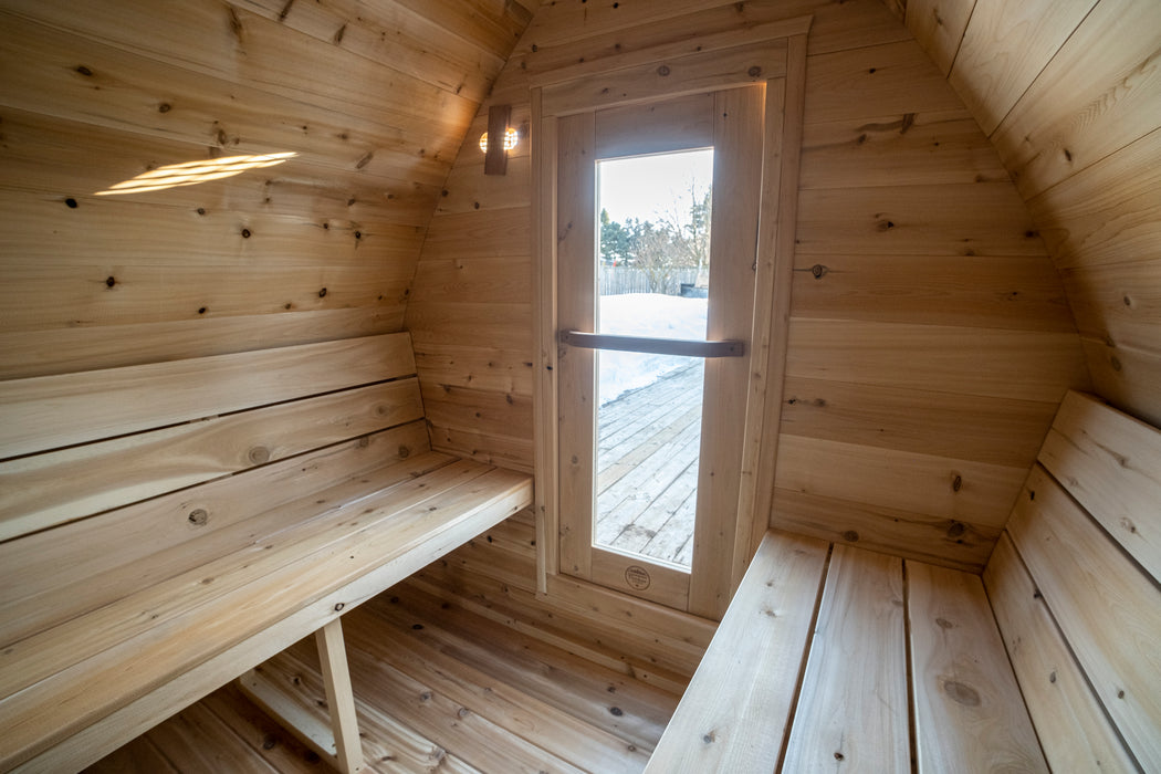 CT MiniPOD Sauna: 7x7, Handcrafted in Canada, 1.5" Eastern White Cedar, Seating for 4, Tempered Glass Door, Asphalt Shingles, Wood Burning or Electric Heater Options.