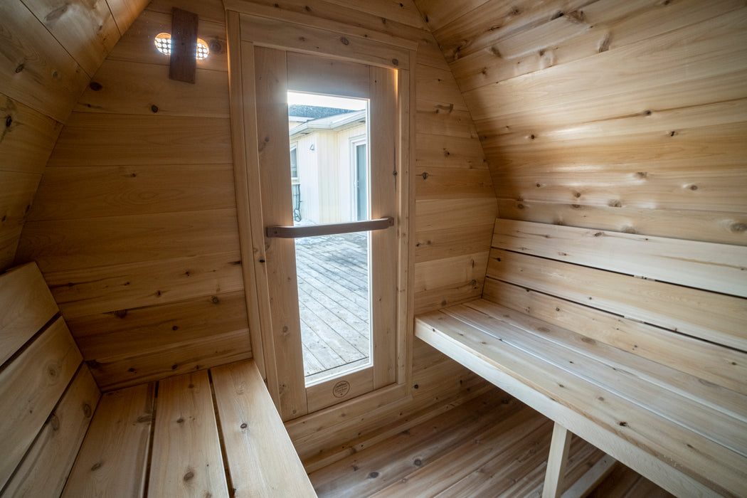 CT MiniPOD Sauna: 7x7, Handcrafted in Canada, 1.5" Eastern White Cedar, Seating for 4, Tempered Glass Door, Asphalt Shingles, Wood Burning or Electric Heater Options.