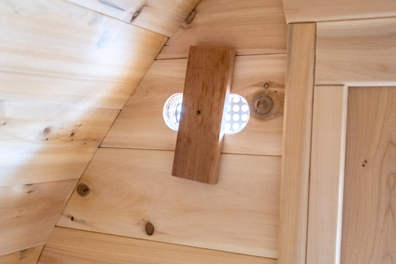 CT MiniPOD Sauna: 7x7, Handcrafted in Canada, 1.5" Eastern White Cedar, Seating for 4, Tempered Glass Door, Asphalt Shingles, Wood Burning or Electric Heater Options.