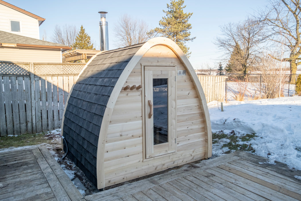 CT MiniPOD Sauna: 7x7, Handcrafted in Canada, 1.5" Eastern White Cedar, Seating for 4, Tempered Glass Door, Asphalt Shingles, Wood Burning or Electric Heater Options.