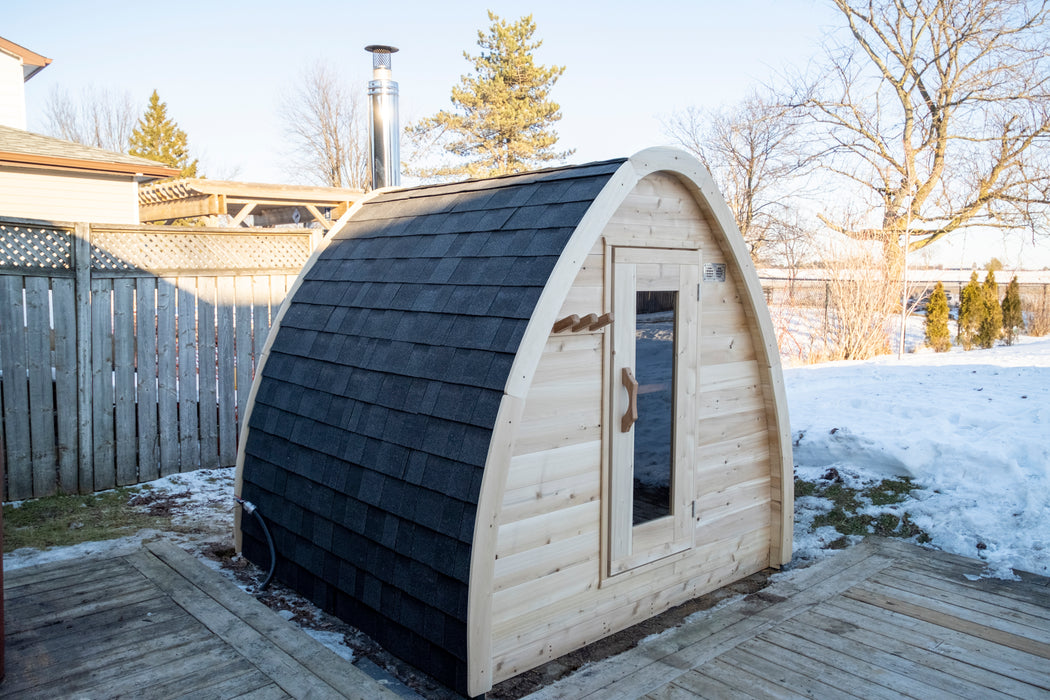 CT MiniPOD Sauna: 7x7, Handcrafted in Canada, 1.5" Eastern White Cedar, Seating for 4, Tempered Glass Door, Asphalt Shingles, Wood Burning or Electric Heater Options.