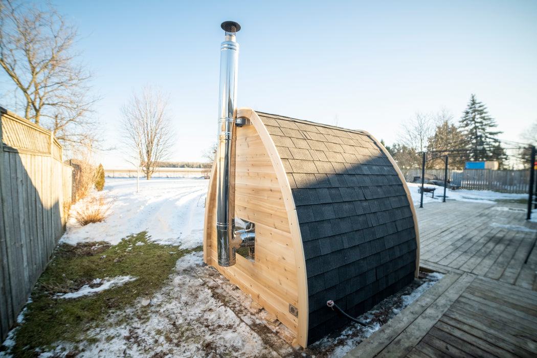 CT MiniPOD Sauna: 7x7, Handcrafted in Canada, 1.5" Eastern White Cedar, Seating for 4, Tempered Glass Door, Asphalt Shingles, Wood Burning or Electric Heater Options.