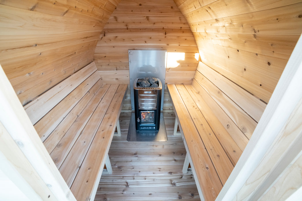 CT MiniPOD Sauna: 7x7, Handcrafted in Canada, 1.5" Eastern White Cedar, Seating for 4, Tempered Glass Door, Asphalt Shingles, Wood Burning or Electric Heater Options.