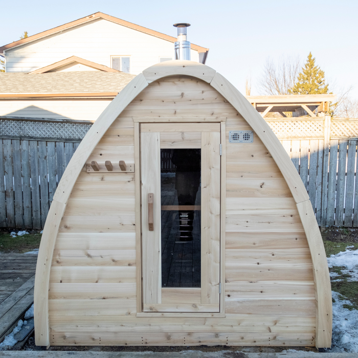 CT MiniPOD Sauna: 7x7, Handcrafted in Canada, 1.5" Eastern White Cedar, Seating for 4, Tempered Glass Door, Asphalt Shingles, Wood Burning or Electric Heater Options.